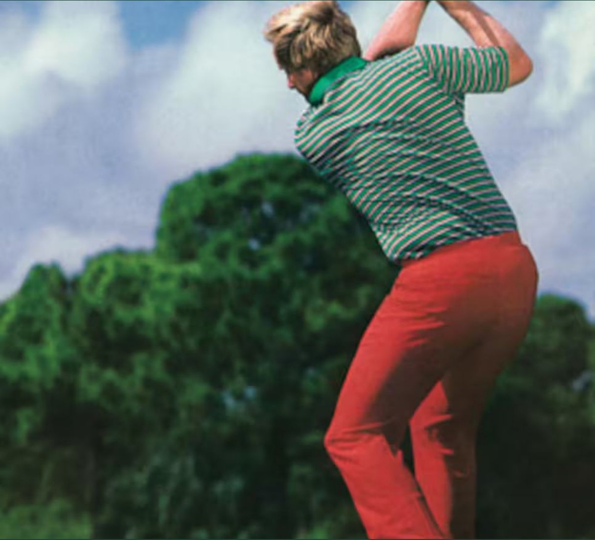 Archive frame of Jack mid-swing in a green striped knit and red trousers.